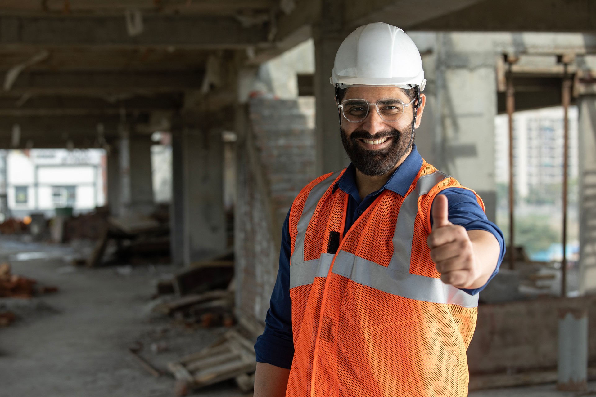 Cheerful young man fixing electrical wall socket